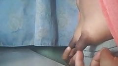 Young cam girl plays with her giant nipples